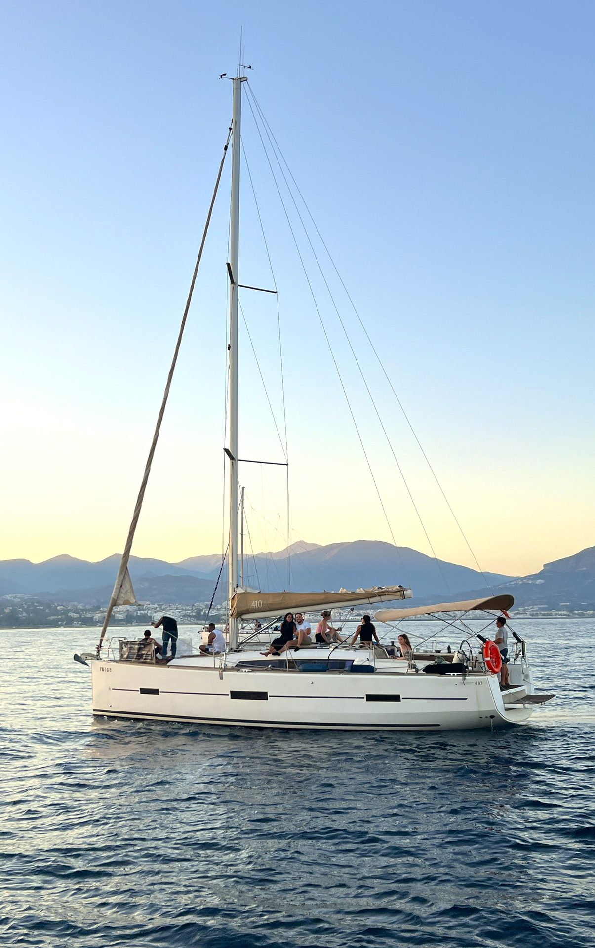 Váruna, a modern Dufour 410 sailing yacht under sail off Marbella