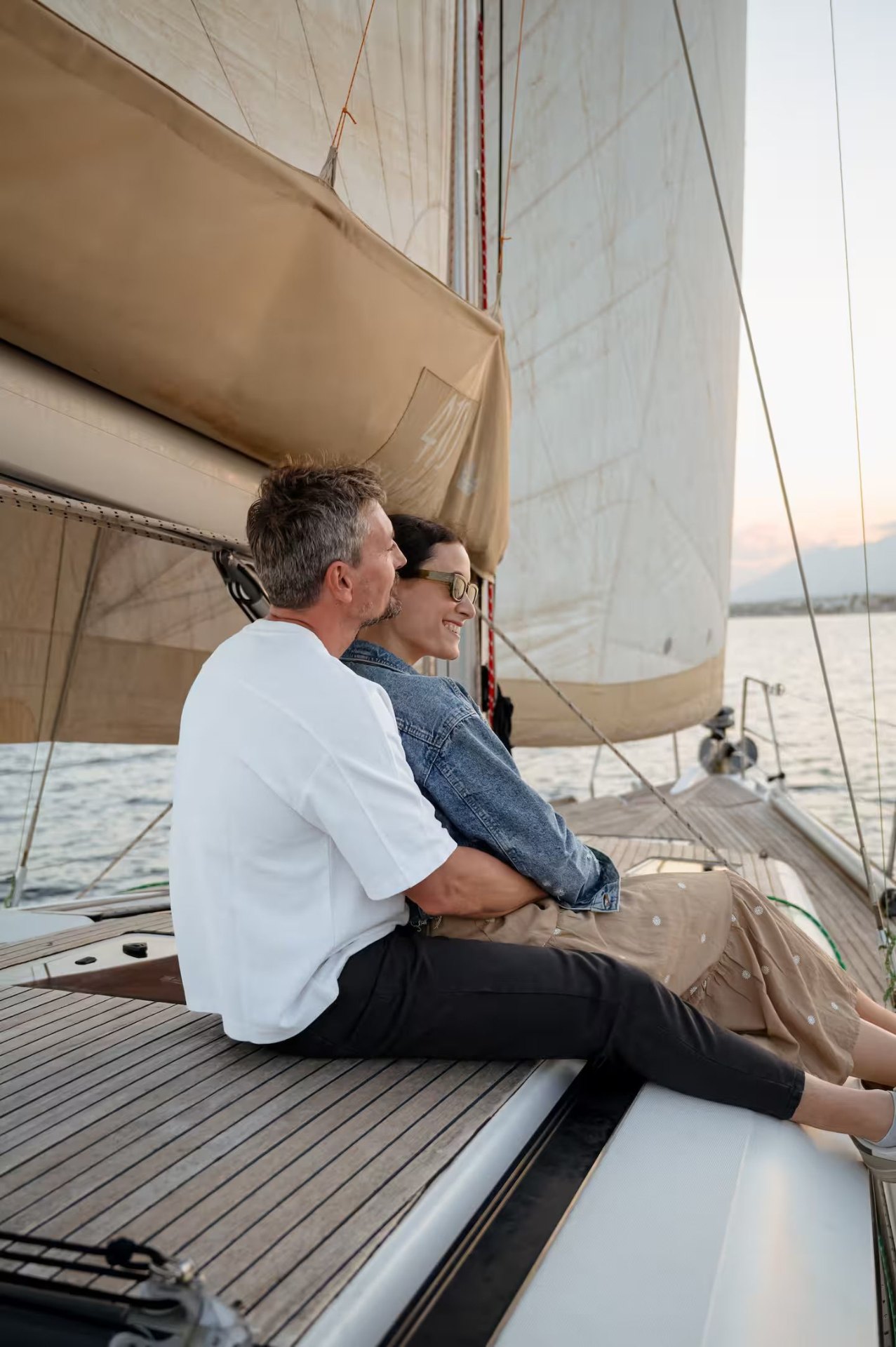 Couple watching the sunset aboard Neptuno, a Beneteau Oceanis 48, off Marbella