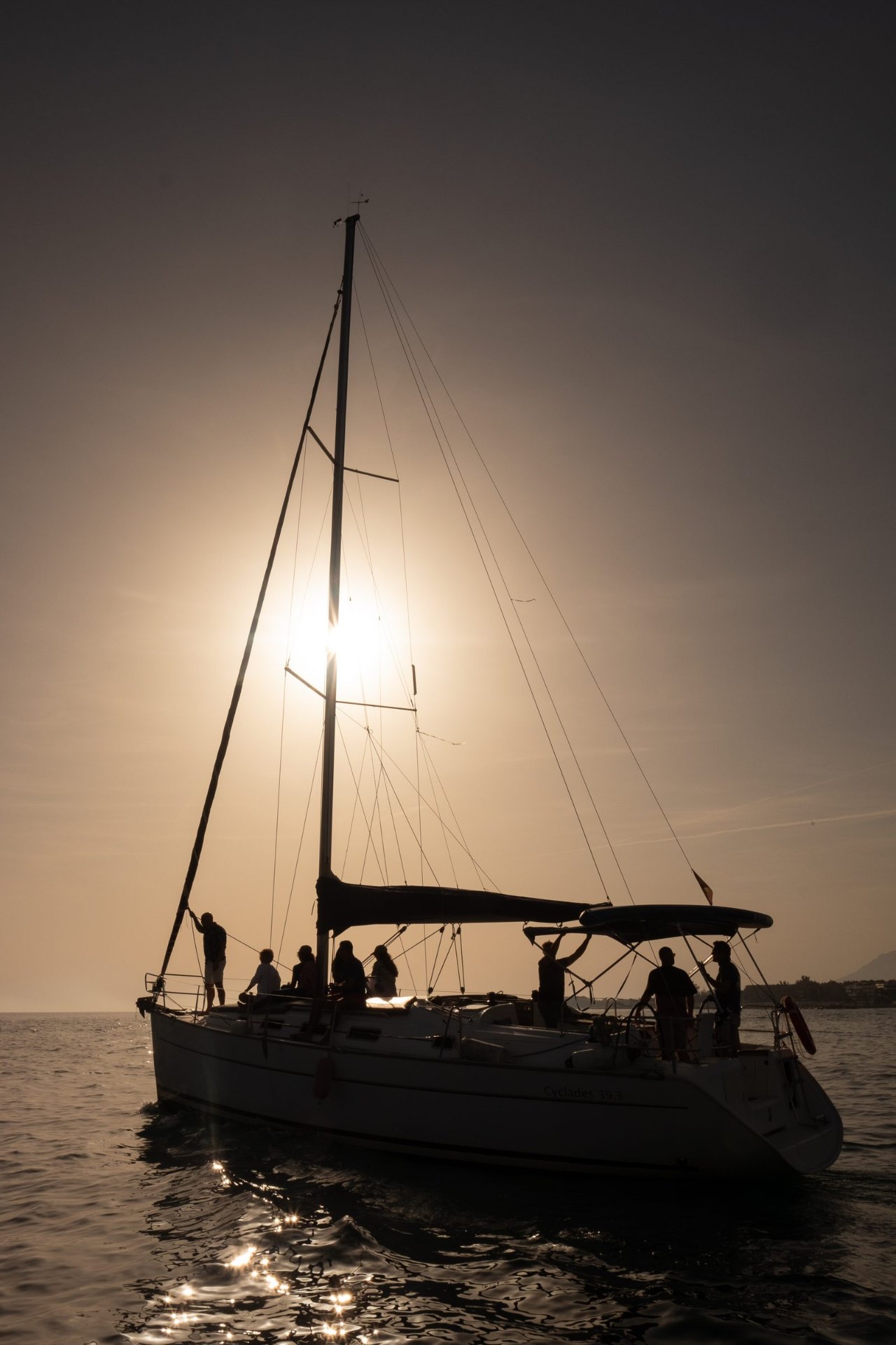 Sailing yacht silhouetted against the sunset on a sunset sail from Puerto Banús, Marbella