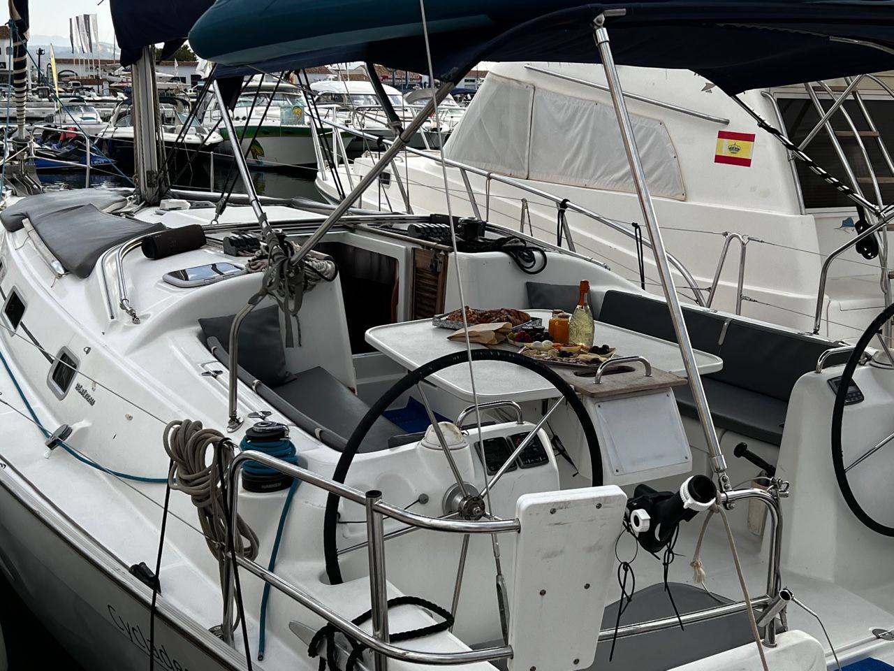 Guests on a small boat during a swim stop off Puerto Banús, Marbella