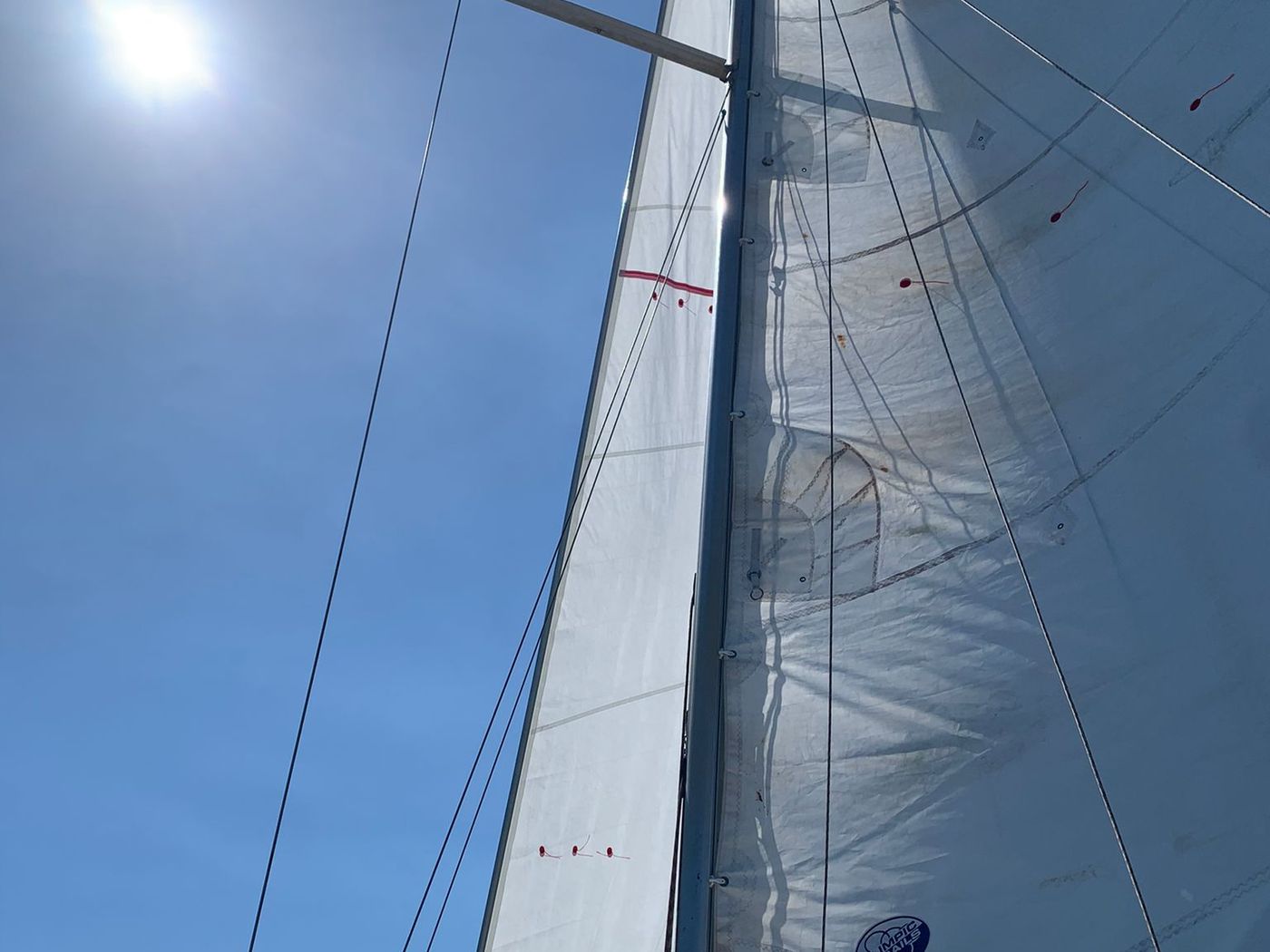 Catamaran under sail off Marbella with La Concha mountain behind